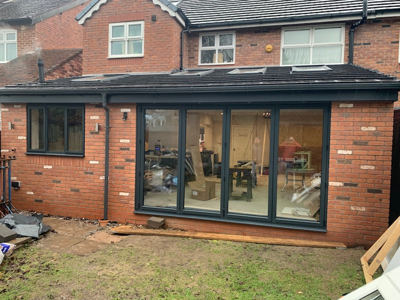 new anthracite grey bi fold doors installed in Stockport